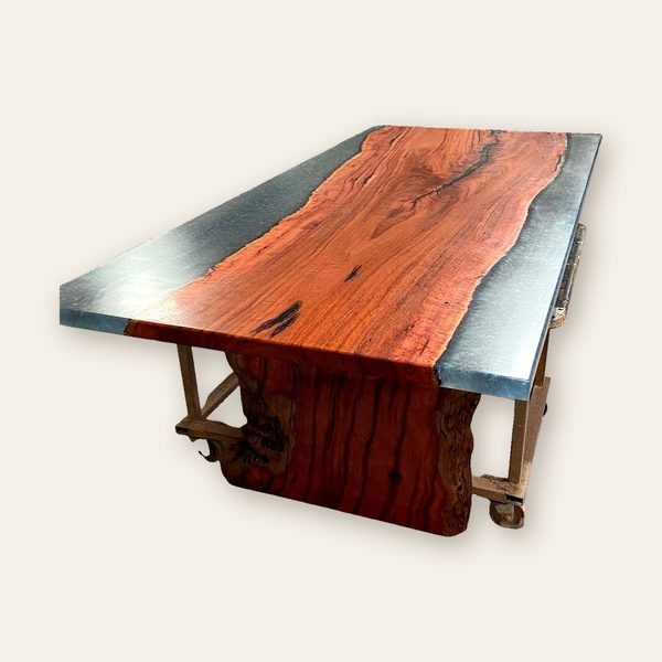 Jarrah table with a grey resin river along one edge