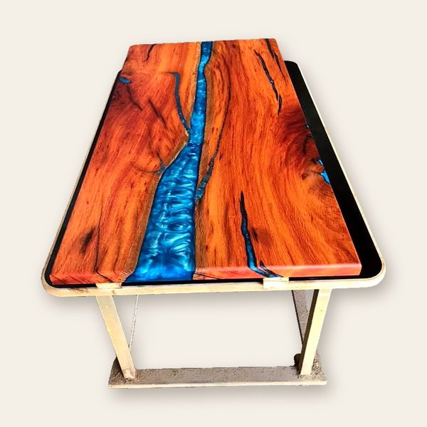 Orange marri table top with a blue resin river