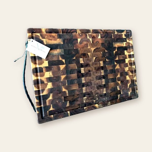Dark end-grain chopping block with a juice groove