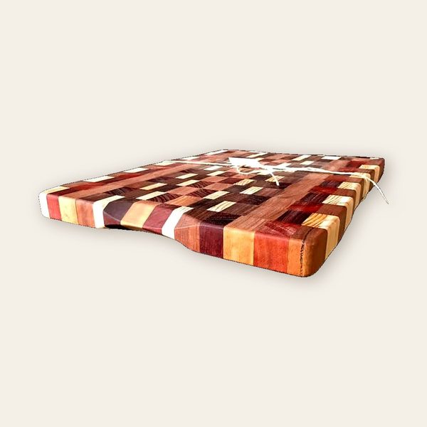 Thick end-grain chopping block in red, cream and brown stripes