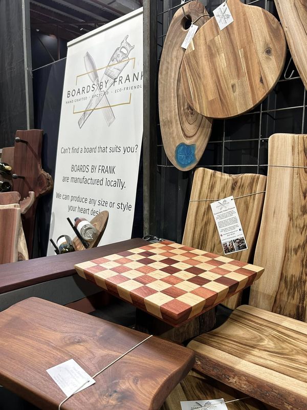Chess board and boards in front of Boards by Frank banner