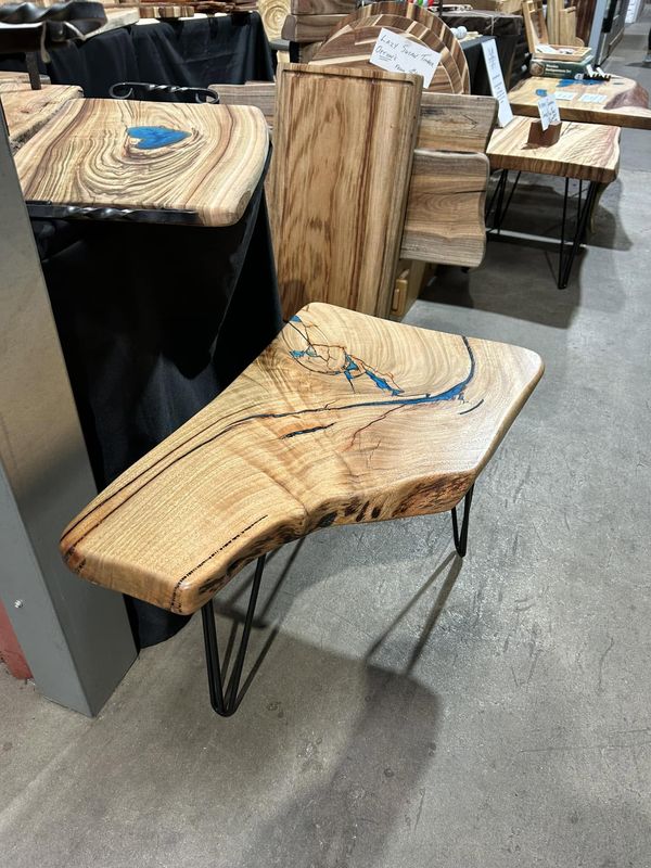 Live-edge side table with blue resin inlay, hairpin legs