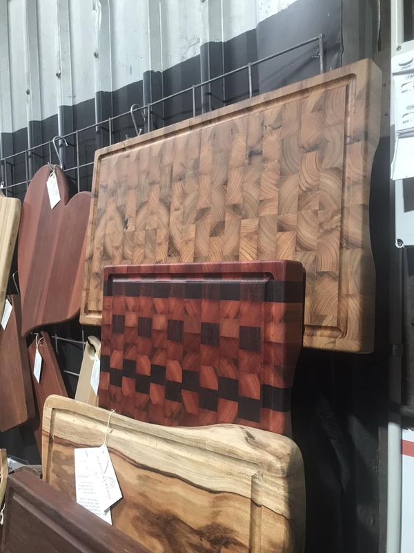 End-grain chopping boards hanging on wall
