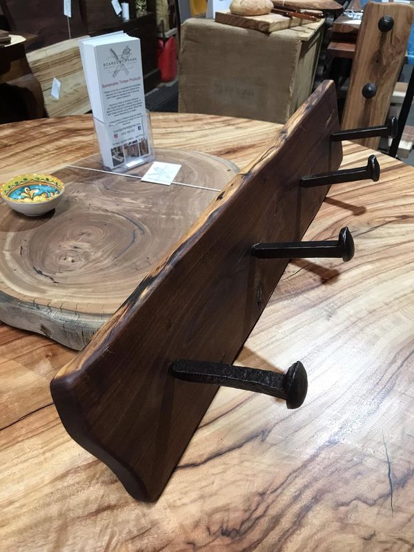 Dark coat-hook board with forged nail hooks