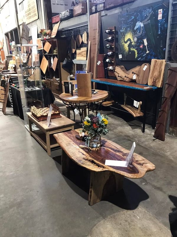 Stall overview with coffee table and wine racks