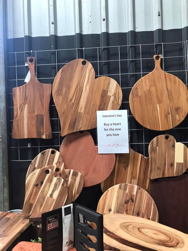 Heart and round paddle boards on wall, Valentine's sign
