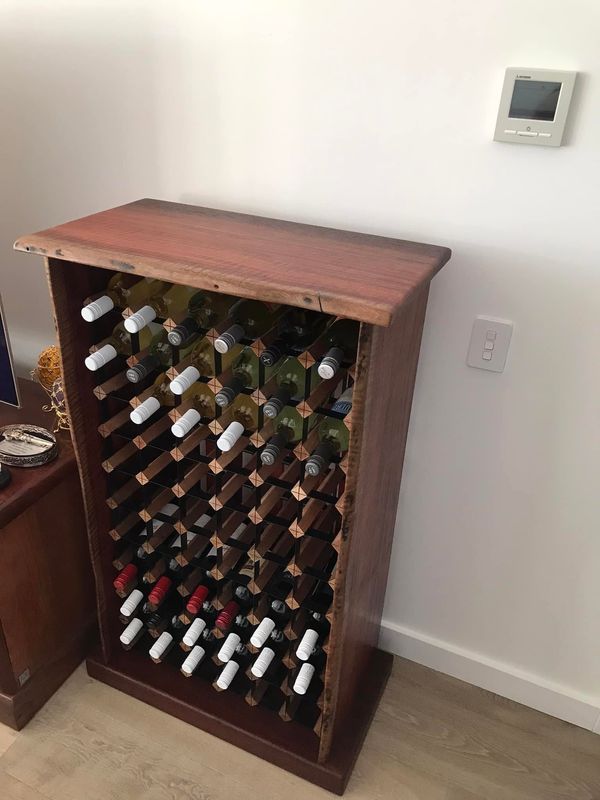 Jarrah wine cabinet, full of bottles