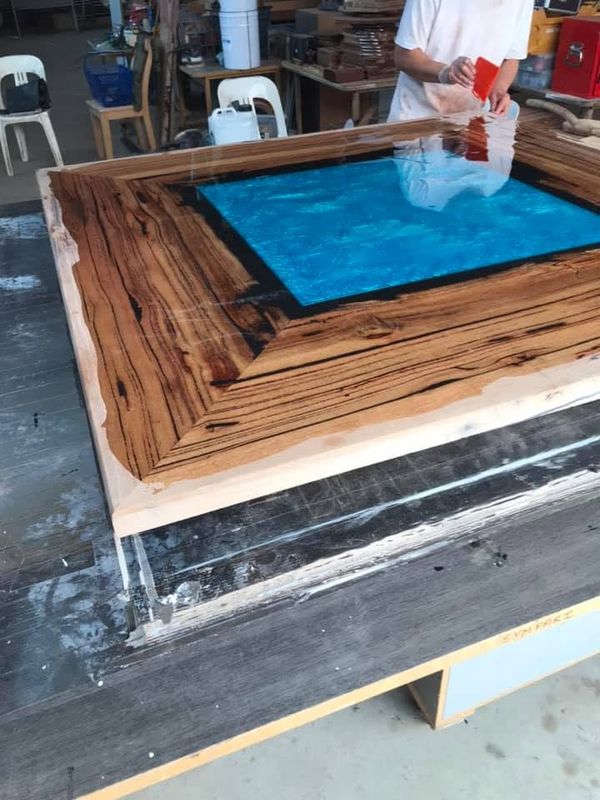 Resin pour: turquoise centre in mitred frame