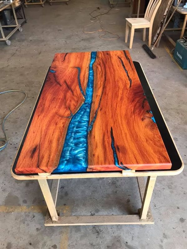Orange marri table with blue river, top view
