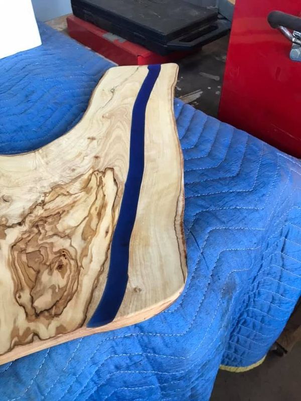 Pale board with dark blue resin stripe