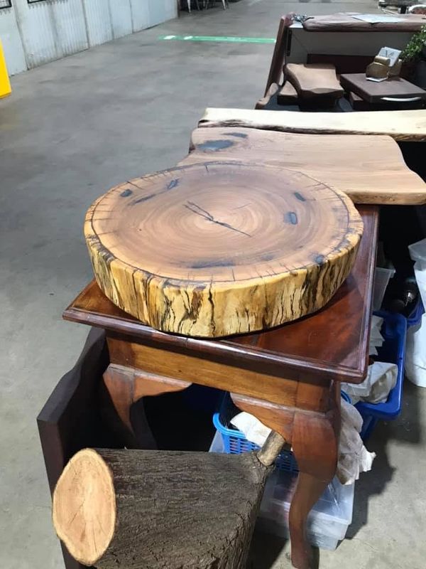 Thick round slab with bark edge on side table