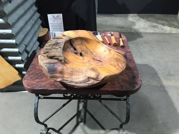 Burl bowl on a wrought-iron table
