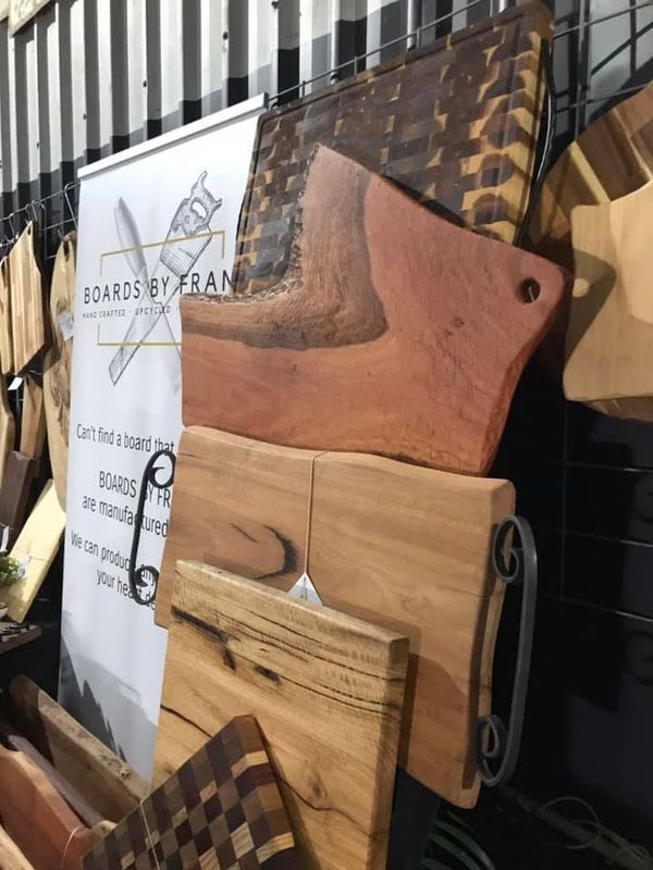 Boards with wrought-iron handles by banner