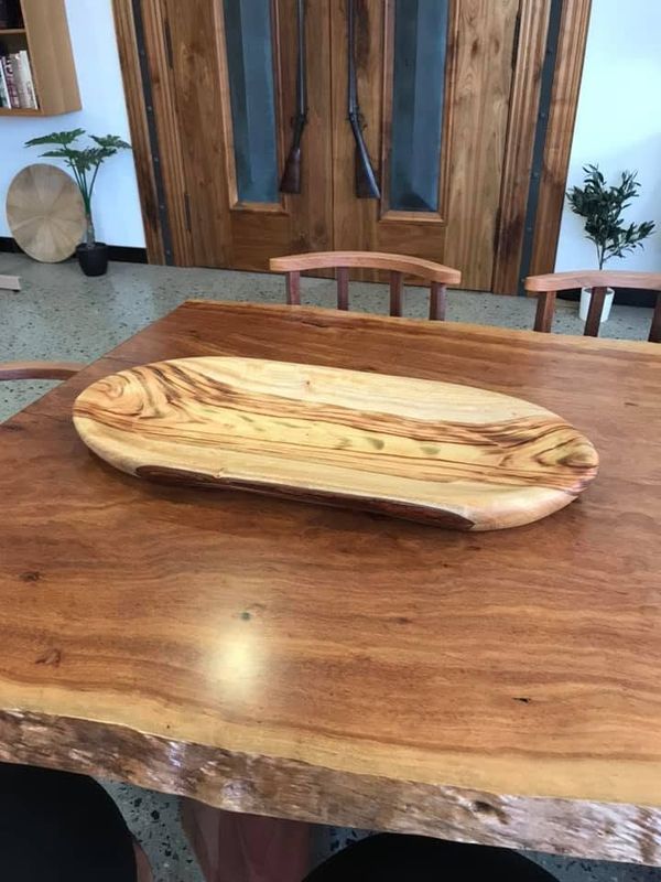 Carved sheoak serving platter on jarrah table