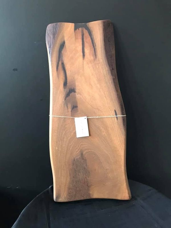 Long board with dark streaks