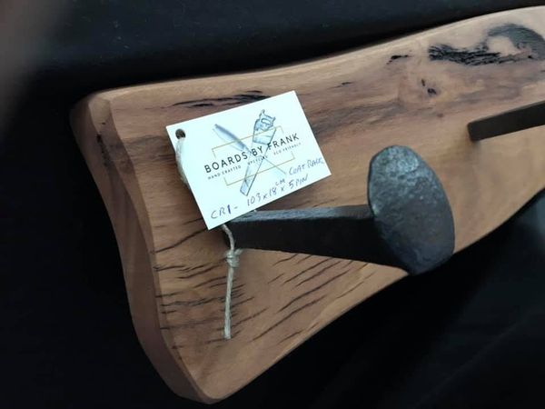 Coat hook board with branded tag